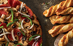 $1 for 6 Garlic Parmesan Twists with purchase of Large or X-Large Specialty Pizza