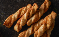 Order 3 Garlic Parmesan Twists food online from Round Table Pizza store, Salinas on bringmethat.com